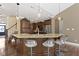 Granite countertop kitchen island featuring stainless steel appliances and barstool seating at 3965 Andretti Dr, Zionsville, IN 46077