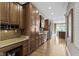 Spacious kitchen featuring wooden cabinets, granite countertops, and stainless steel appliances at 3965 Andretti Dr, Zionsville, IN 46077