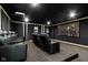 A home theater room complete with seating, projector, and a large screen at 3965 Andretti Dr, Zionsville, IN 46077
