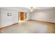 Spacious basement with carpet floors, white walls, and a door to the staircase at 4316 Moss Ridge Cir, Indianapolis, IN 46237