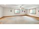 Open basement with carpet floors, white walls, and a ceiling fan at 4316 Moss Ridge Cir, Indianapolis, IN 46237