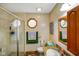 Bathroom featuring a glass shower, granite countertops, a mirror and an octagon window at 4316 Moss Ridge Cir, Indianapolis, IN 46237