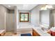 Bathroom with a soaking tub, skylight, glass shower and tile flooring at 4316 Moss Ridge Cir, Indianapolis, IN 46237