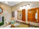 Bathroom featuring granite countertops, double sinks, and a framed mirror at 4316 Moss Ridge Cir, Indianapolis, IN 46237