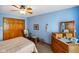 Charming bedroom features a ceiling fan, wood accents, and ample closet space at 4316 Moss Ridge Cir, Indianapolis, IN 46237