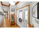 Warm foyer featuring hardwood floors, elegant decor, and a welcoming entrance leading into the home at 4316 Moss Ridge Cir, Indianapolis, IN 46237