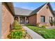 Charming front porch of a brick home, featuring a welcoming entrance, decorative elements, and manicured landscaping at 4316 Moss Ridge Cir, Indianapolis, IN 46237