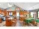 Eat-in kitchen features light wood cabinets, a dining table, and a center island with seating at 4316 Moss Ridge Cir, Indianapolis, IN 46237