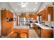 Spacious kitchen features wooden cabinets, stainless appliances, and a center island with seating at 4316 Moss Ridge Cir, Indianapolis, IN 46237