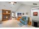 Inviting living room with a brick fireplace, comfortable seating, and a ceiling fan at 4316 Moss Ridge Cir, Indianapolis, IN 46237