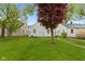 Well-maintained backyard featuring a healthy lawn and surrounding houses at 46 N Kitley Ave, Indianapolis, IN 46219