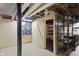 Unfinished basement with a dart board, storage, and work table at 46 N Kitley Ave, Indianapolis, IN 46219