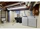 A basement features a toilet, a sink, and laundry machines at 46 N Kitley Ave, Indianapolis, IN 46219