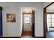 Inviting entryway with an open view of the white storm door and the lush green yard at 46 N Kitley Ave, Indianapolis, IN 46219
