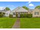 Charming home featuring lush green lawn, and decorative hedges enhance the curb appeal at 46 N Kitley Ave, Indianapolis, IN 46219