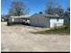 Row of detached garages in a residential neighborhood with peeling paint and weathered asphalt at 46 N Kitley Ave, Indianapolis, IN 46219