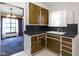 Vintage kitchen with wood cabinets and double basin sink at 46 N Kitley Ave, Indianapolis, IN 46219