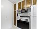 Kitchen with appliances including microwave, refrigerator, and stove at 46 N Kitley Ave, Indianapolis, IN 46219