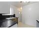 Traditional kitchen with sink, wood cabinets, and white appliances at 46 N Kitley Ave, Indianapolis, IN 46219