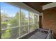 Serene view from the screened-in porch, showing the lush greenery and neighborhood landscape at 46 N Kitley Ave, Indianapolis, IN 46219