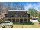 A large log cabin home boasts multiple levels, a gazebo, a large yard, and mature trees at 4840 N Templin Rd, Martinsville, IN 46151