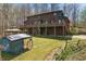 Expansive log home backyard with a gazebo, lush green grass, and wooded surroundings at 4840 N Templin Rd, Martinsville, IN 46151