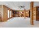 Open finished basement with wood paneling and carpeted floors, enhanced by ample space for various activities at 4840 N Templin Rd, Martinsville, IN 46151