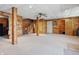 Finished basement featuring wood walls, recessed lighting, and a staircase at 4840 N Templin Rd, Martinsville, IN 46151