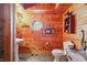 Half bathroom with a pedestal sink and a rustic design at 4840 N Templin Rd, Martinsville, IN 46151