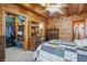 Wood-walled bedroom with ceiling fan, view of walk-in closet, and an adjacent room at 4840 N Templin Rd, Martinsville, IN 46151