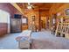 Spacious bedroom featuring wood walls, a ceiling fan, and access to the bathroom and closet at 4840 N Templin Rd, Martinsville, IN 46151
