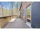 The spacious wooden deck offers relaxing views of the surrounding trees and landscape at 4840 N Templin Rd, Martinsville, IN 46151