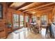Bright dining room with wood paneled walls and ceilings features wood floors and a patio walkout at 4840 N Templin Rd, Martinsville, IN 46151