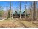 Cozy log cabin with a metal roof surrounded by trees, offering a secluded and peaceful retreat at 4840 N Templin Rd, Martinsville, IN 46151