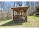 A wooden gazebo provides a relaxing outdoor space surrounded by lush greenery at 4840 N Templin Rd, Martinsville, IN 46151