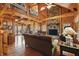 Inviting living room with a stone fireplace, wood paneling, high ceilings, and natural light at 4840 N Templin Rd, Martinsville, IN 46151