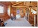 Charming loft area with wood paneling, a rocking chair, and natural light, offering a relaxing retreat at 4840 N Templin Rd, Martinsville, IN 46151