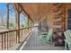 Covered porch with wooden floors, and handrails providing a relaxing outdoor space at 4840 N Templin Rd, Martinsville, IN 46151