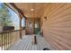 A charming log cabin style porch with seating and views of the surrounding landscape at 4840 N Templin Rd, Martinsville, IN 46151