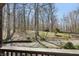 Wooded view from the home's porch, with a glimpse of trees and natural landscaping at 4840 N Templin Rd, Martinsville, IN 46151