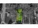 Aerial view showcasing the property's lot, bordered by mature trees at 4914 Indianola Ave, Indianapolis, IN 46205