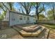 View of the backyard with a multi-tiered wooden deck perfect for outdoor relaxation and entertaining, surrounded by grass at 4914 Indianola Ave, Indianapolis, IN 46205
