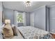 Bedroom features hardwood floors, natural light, and closet with doors at 4914 Indianola Ave, Indianapolis, IN 46205