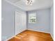 Bedroom with hardwood floors, large closet and natural light from the window at 4914 Indianola Ave, Indianapolis, IN 46205