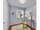 Home office space with hardwood floors, desk, and natural light from window at 4914 Indianola Ave, Indianapolis, IN 46205