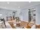 Bright living room featuring hardwood floors, a neutral sofa, stylish decor and lots of natural light at 4914 Indianola Ave, Indianapolis, IN 46205