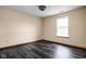 Bedroom featuring dark wood-look vinyl floors and a window allowing natural light at 504 Countryside Dr, Lebanon, IN 46052