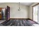 A dining area featuring dark floors and a sliding glass door leading to the patio at 504 Countryside Dr, Lebanon, IN 46052
