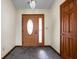 Foyer with tile flooring, a decorative front door, and sidelight at 504 Countryside Dr, Lebanon, IN 46052