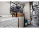 Laundry room with washer, dryer, storage shelves, and mechanicals at 504 Countryside Dr, Lebanon, IN 46052